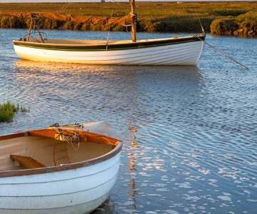 Norfolk river with two boats